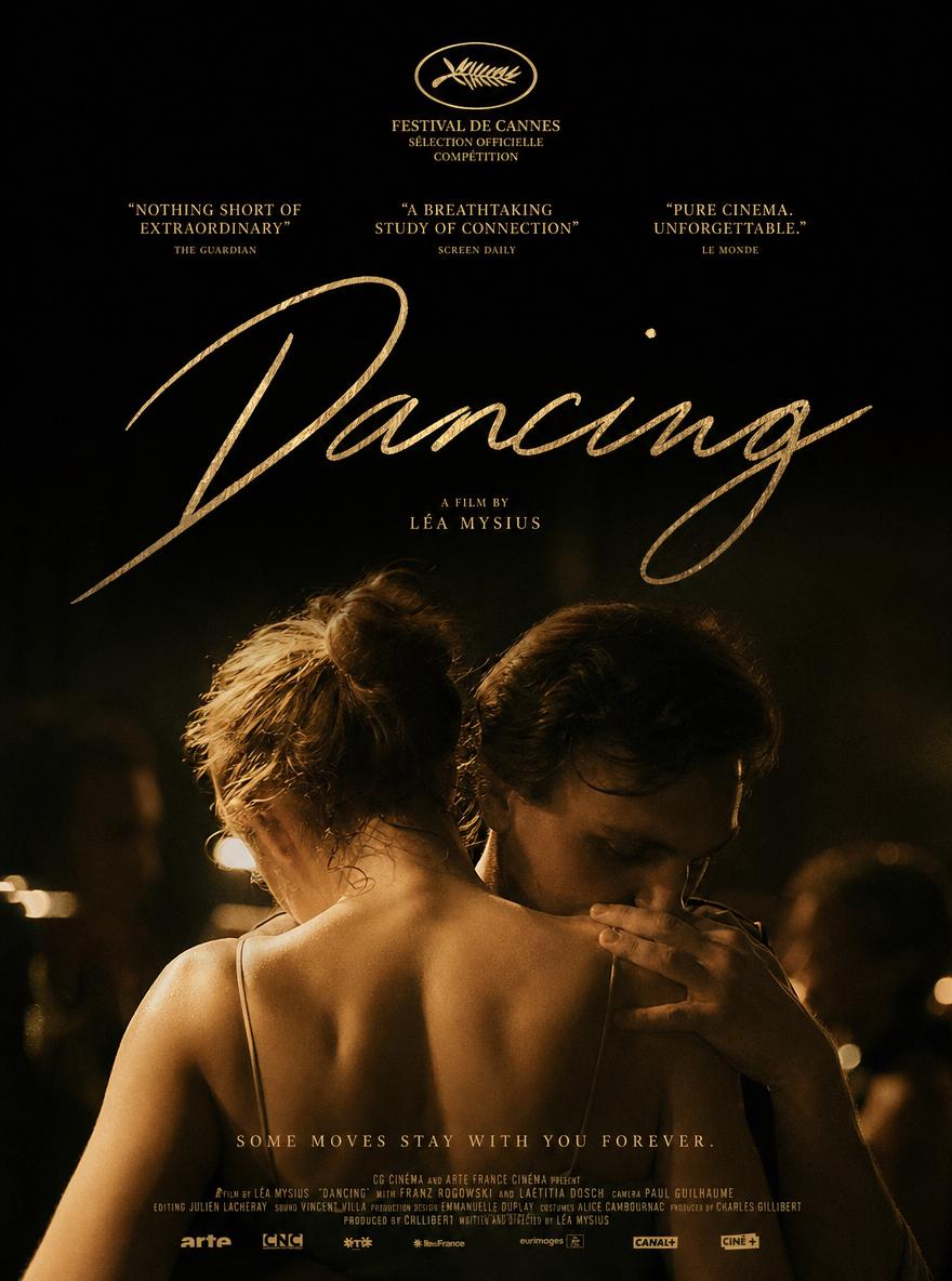 Two Individuals Share An Intimate Dance In A Dimly Lit Atmospheric Setting