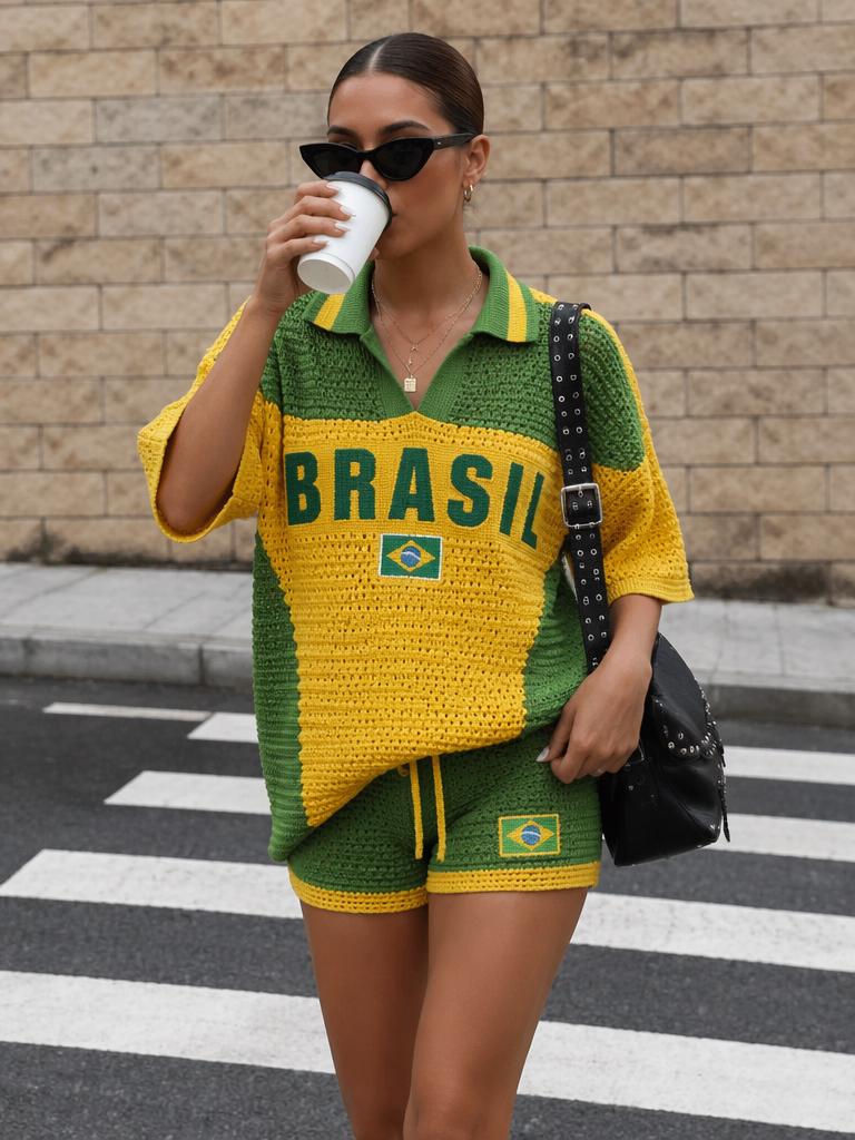 A Woman Is Wearing A Yellow And Green Brazil-Themed Outfit While Drinking From A Cup On A City Street With A Brick Wall In The Background